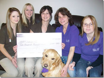 Katrina Jones Beauty Salon presenting a £200.00 cheque to Happy Landings
